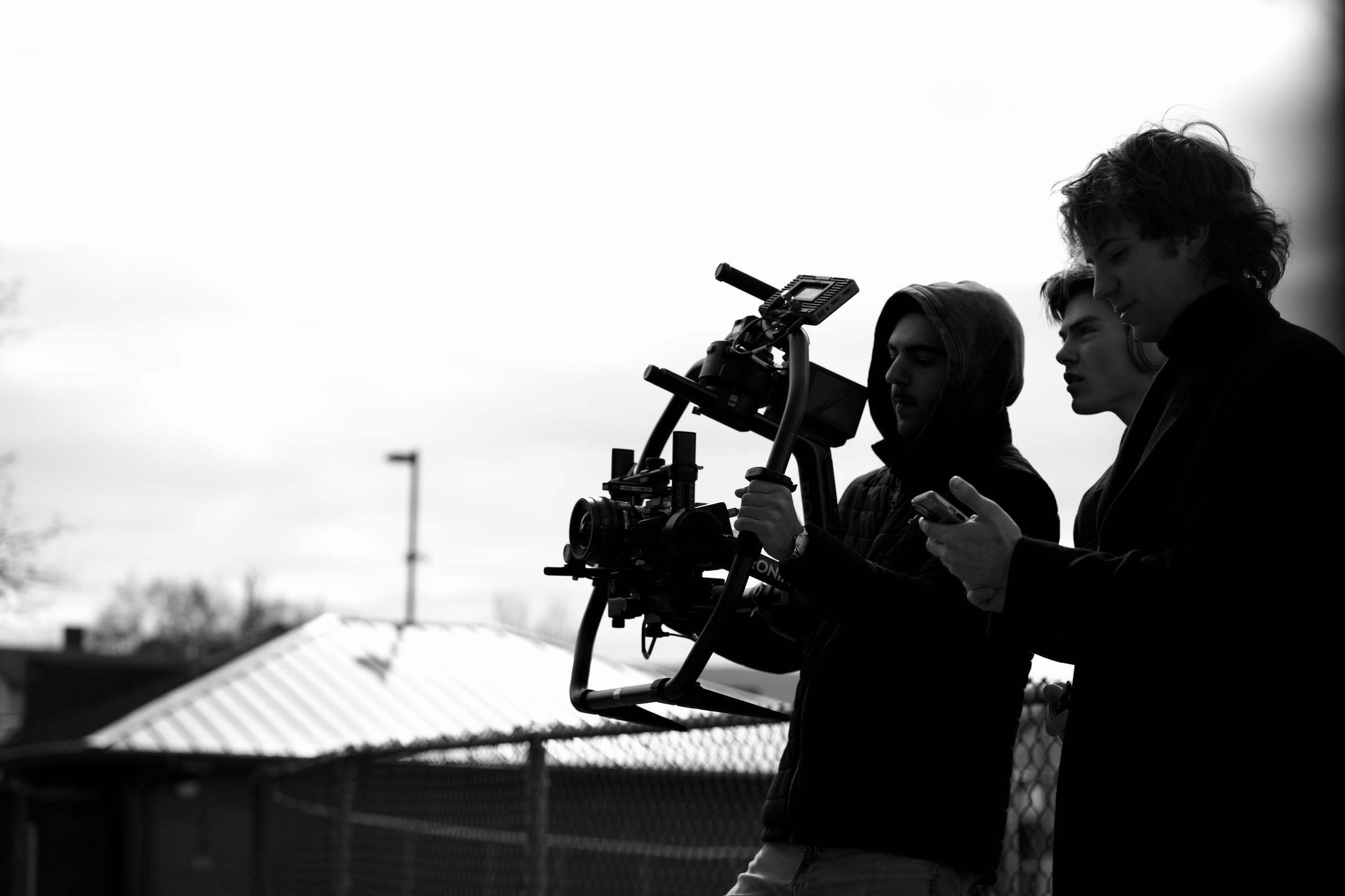 SaberVisualz filmmakers operating a cinema camera on an outdoor set.